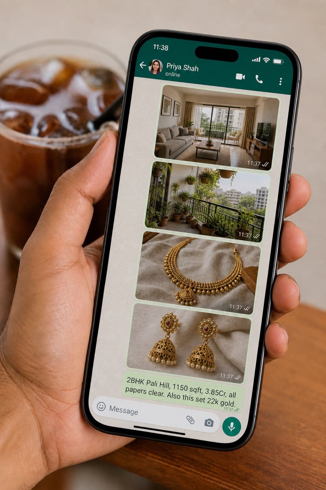 Hand holding a phone open to a WhatsApp chat with apartment and jewellery photos